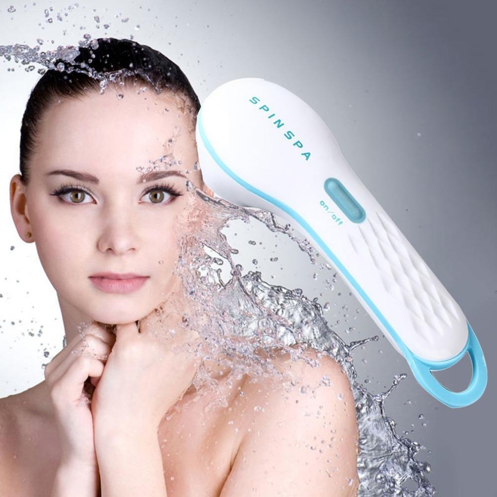 High Quality Skin Beauty Care Electric Facial Cleanser in use with water splashing on a woman's face.