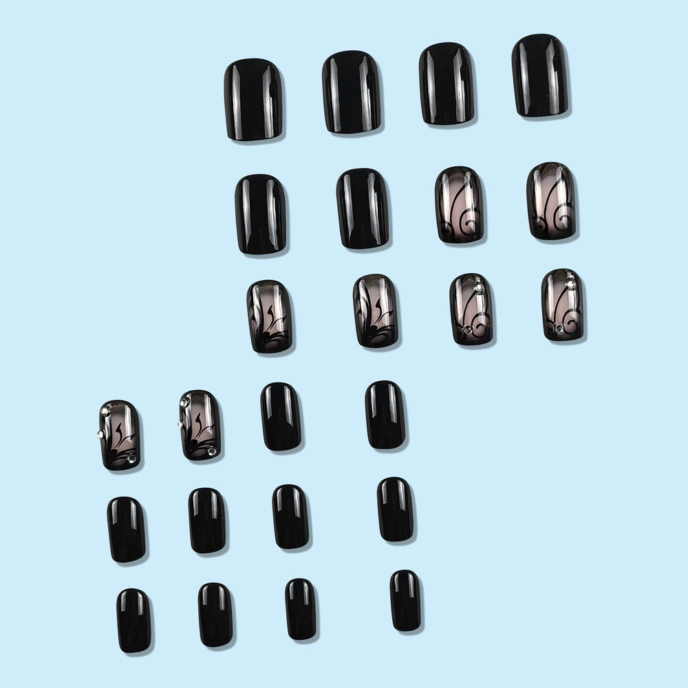 Dark Ins Style Black Vine Wearing Nails And Nails display on light blue background.
